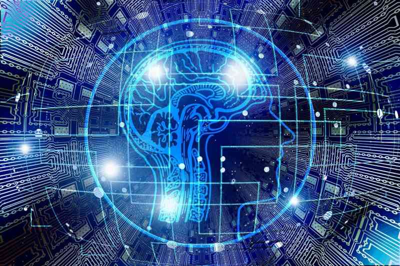 Digital illustration of a human brain within a circuit board pattern, representing IR technology and artificial intelligence integration in modern electronics.